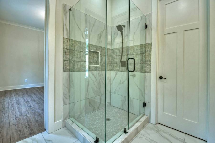 2nd master suite with tile shower - hand painted tile from Spain to accent the tile work.