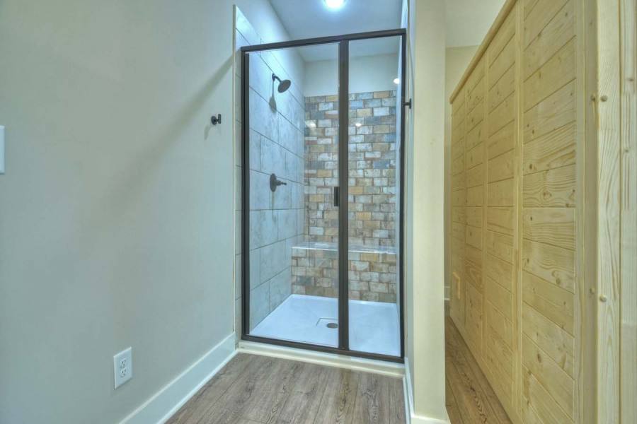 Lower level shower in sauna room