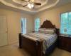 Master bedroom - his/hers closets - double trey ceiling