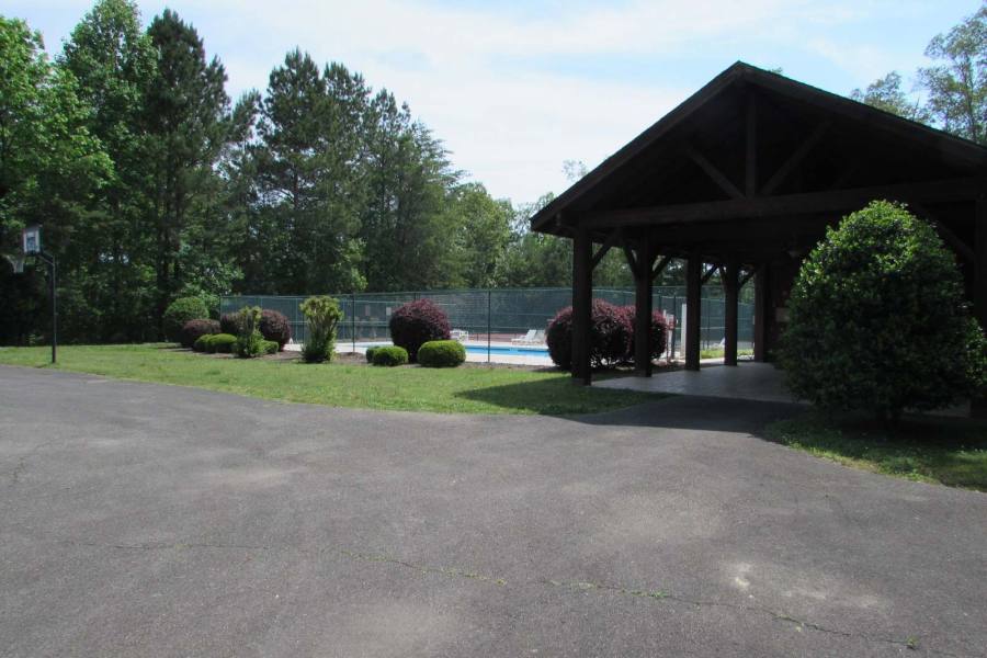 Pool, basket ball goal and picnic pavilion at the back entrance off of Marie Drive